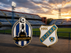Grbovi NK Lokomotiva Zagreb i HNK Rijeka ispred stadiona Maksimir u Zagrebu s travnjakom u pozadini